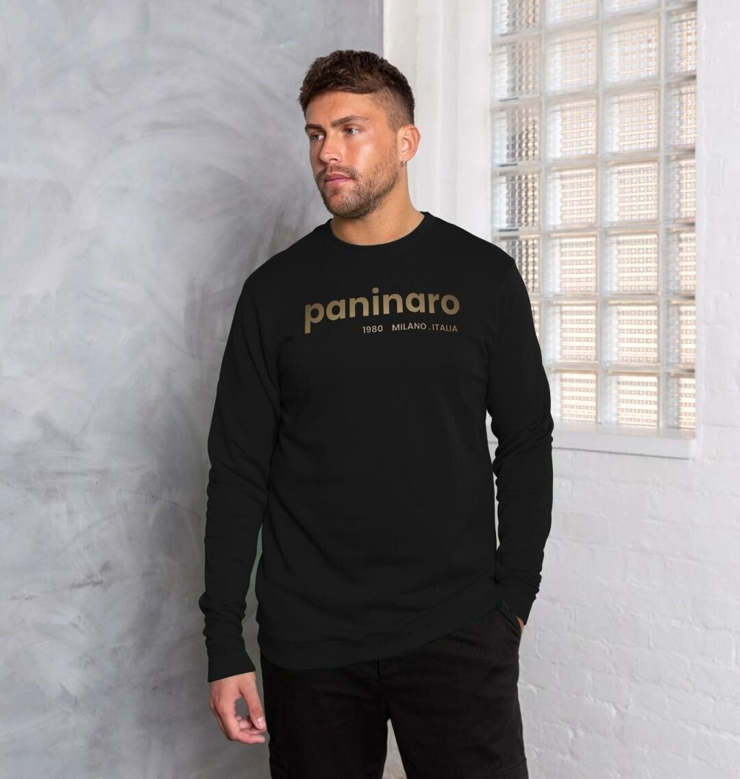 Man wearing Under the Scene Paninaro 1980 Milano Italia sweatshirt in black. The sweatshirt features a stylish design with the word 'Paninaro' and the year 1980, symbolizing classic Italian football casuals culture.