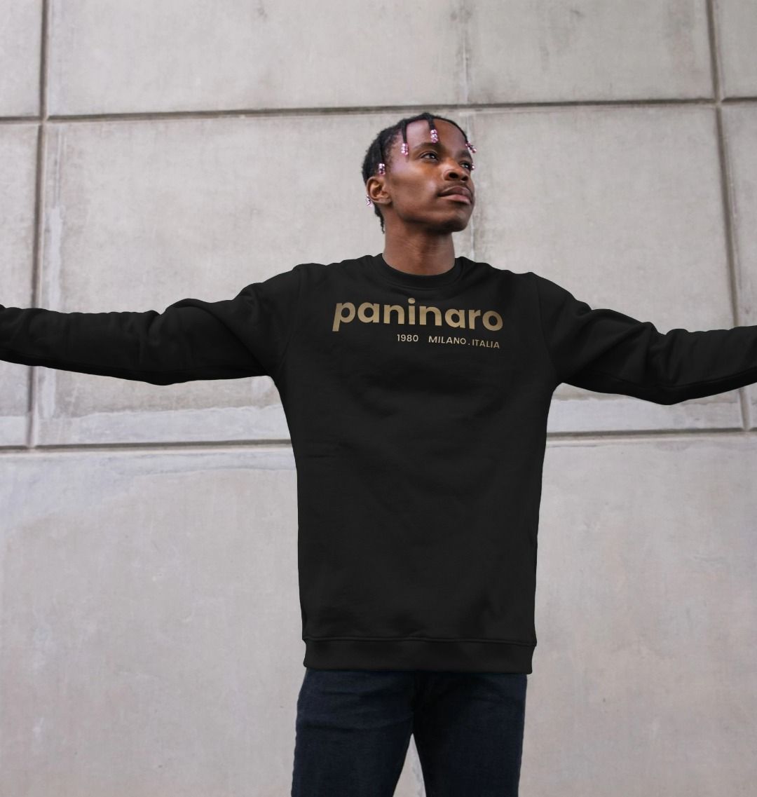 Man wearing Under the Scene Paninaro 1980 Milano Italia sweatshirt in black. The sweatshirt features a stylish design with the word 'Paninaro' and the year 1980, symbolizing classic Italian football casuals culture.