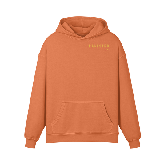 Paninaro 1986 Oversized Hoodie in Copper Red with bold retro typography, inspired by terrace culture.