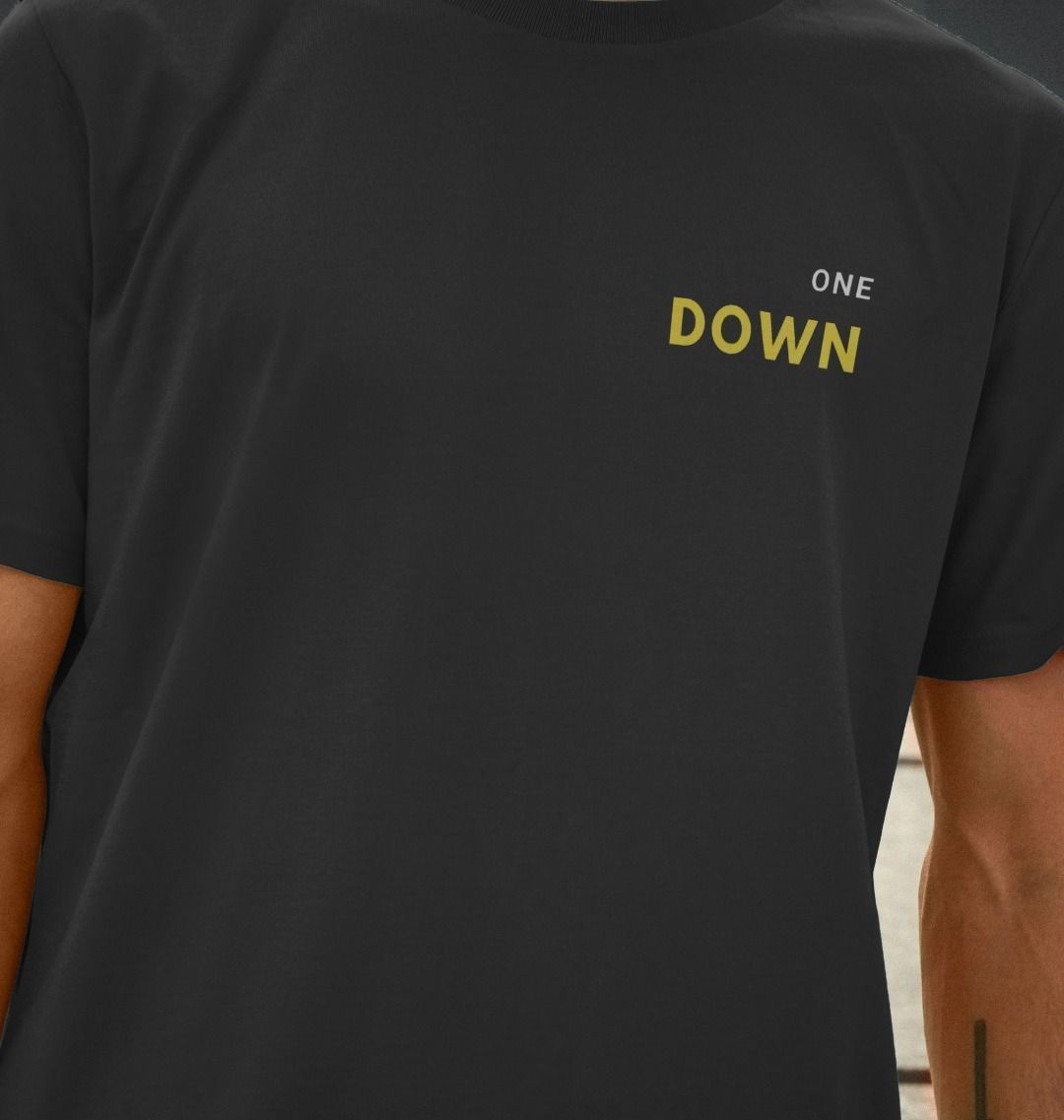 One Down black t-shirt featuring subtle yellow lettering on the front, perfect for minimalist streetwear.